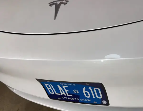 Adhesive license plate replica